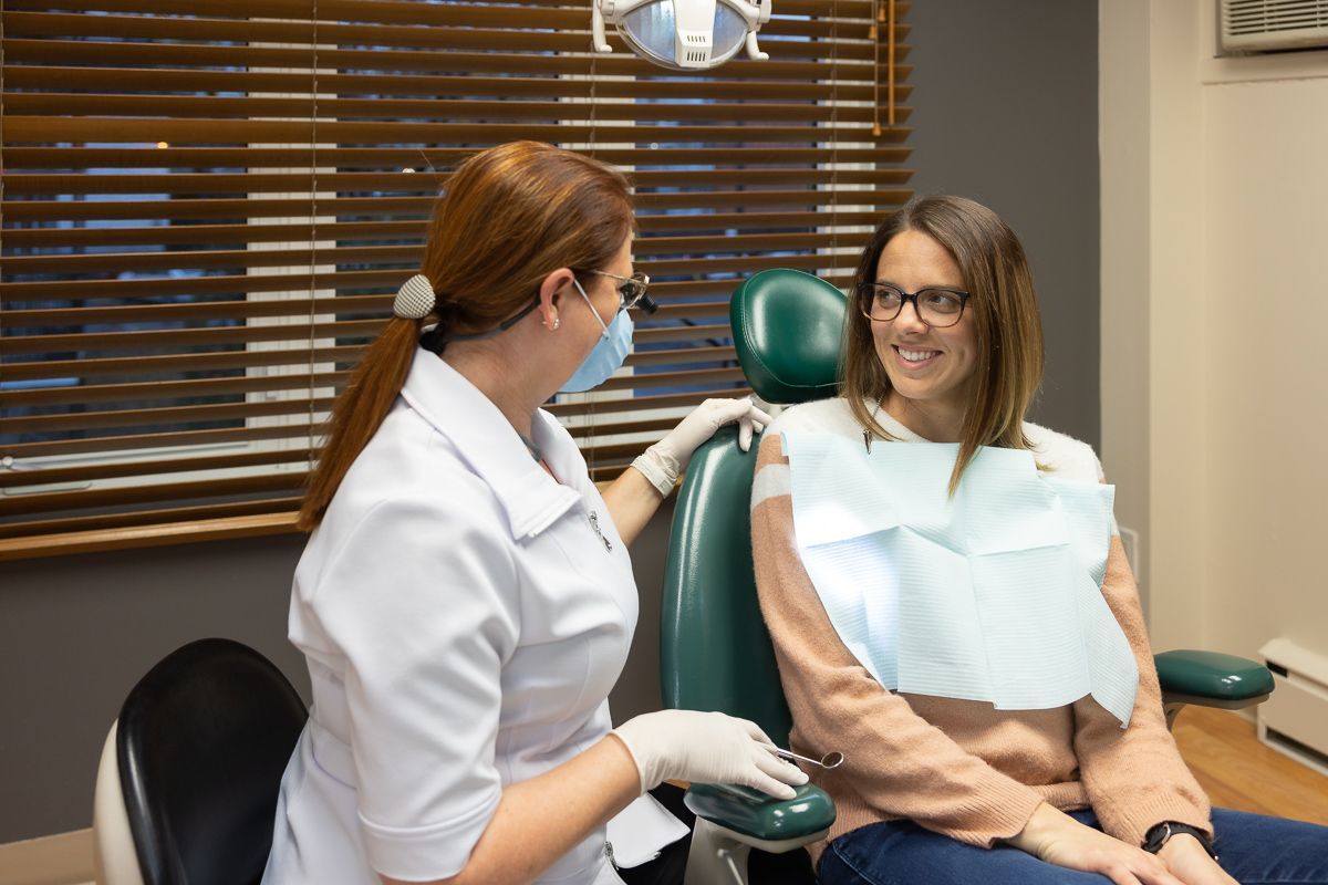 Dentist consulting with a patient